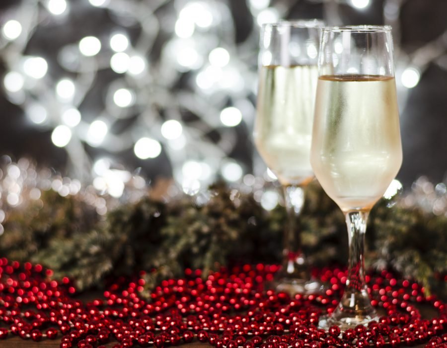 champagne-glasses-with-christmas-lights-background